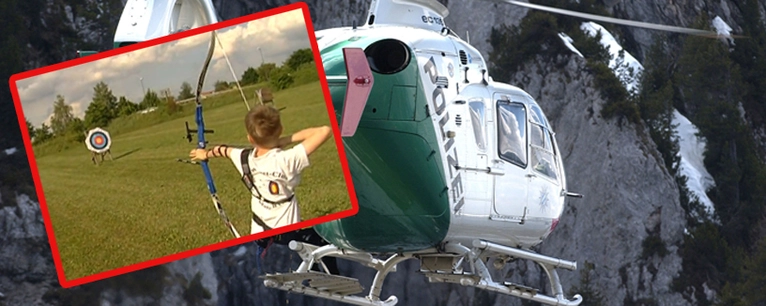 Rettungshubschrauber und Kind beim Bogenschießen — © Symbolfoto